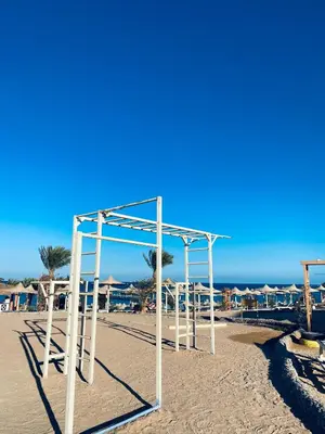 an empty swing set on the beach at Apartment in el karma aqua beach resort hurghada near El gouna in Hurghada