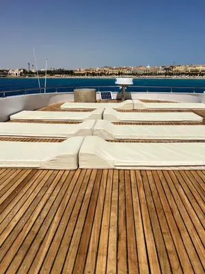 a deck of a boat with wooden flooring at KUBA LuXus tour - Hotel boat in sahl Hashesh - Hurghada in Hurghada