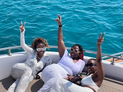 three women sitting on a boat in the water at KUBA LuXus tour - Hotel boat in sahl Hashesh - Hurghada in Hurghada