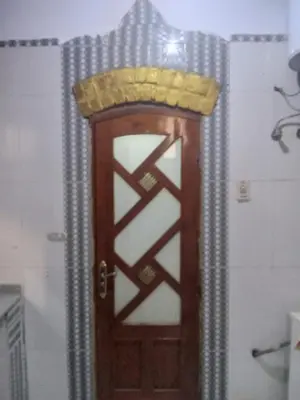 a wooden door with a basket on top of it at Golden Palace Family in Luxor