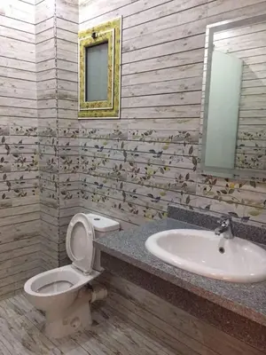 a bathroom with a toilet and a sink at Hurghada Marina in Hurghada