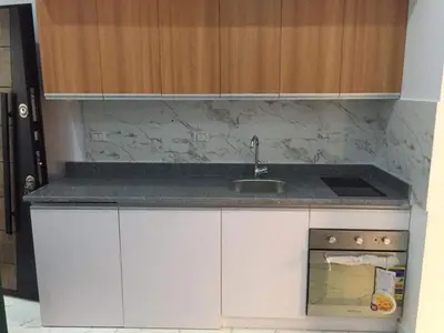 a small kitchen with a sink and a stove at Hurghada Marina in Hurghada