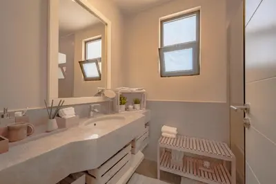 a bathroom with two sinks and a large mirror at Apartment in Tawila ElGouna The Butterfly in Hurghada