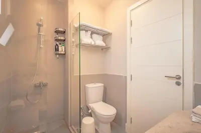 a bathroom with a toilet and a shower at Apartment in Tawila ElGouna The Butterfly in Hurghada