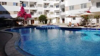 a large swimming pool in front of a building at شقه جديده بالكامل في قلب الغردقه in Hurghada