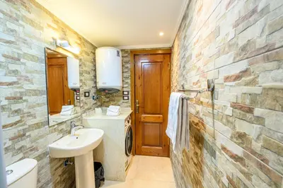 a bathroom with a sink and a toilet at Rhapsody of Luxor in Luxor