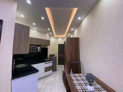 a kitchen with a table and a counter top at ديزرت بيرل in Hurghada