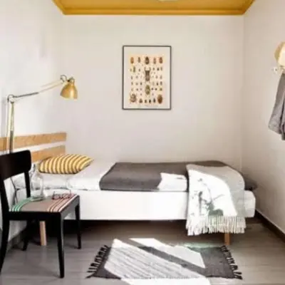 a bedroom with a bed and a chair and a table at Charming Marina Crib Pool Beach Gym Spa in Hurghada