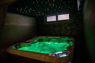 a bathroom with a green bath tub in a room at Charming Marina Crib Pool Beach Gym Spa in Hurghada