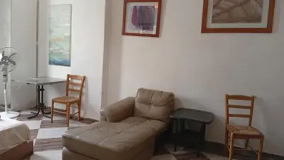 a living room with a couch and two chairs at Charming Marina Crib Pool Beach Gym Spa in Hurghada