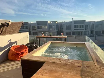 a hot tub on the roof of a building at 1BR with private Heated Jacuzzi at Sholan Elgouna in Hurghada