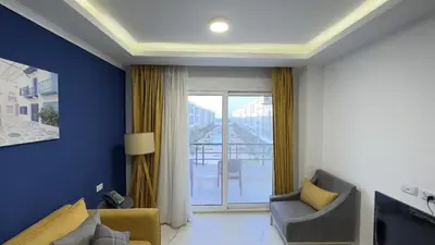a living room with a couch and a window at Fanadir Bay Resort in Hurghada, Egypt in Hurghada