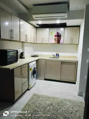 a kitchen with a washer and a dishwasher at Fanadir Bay Resort in Hurghada, Egypt in Hurghada