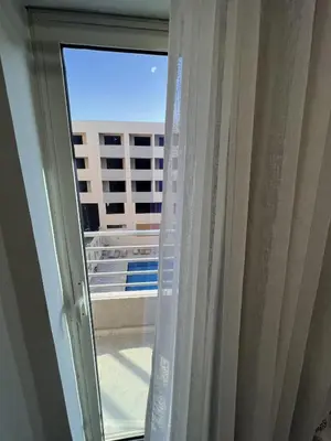 a window with a view of a building at Charming 1-Bed Chalet in Hurghada in Hurghada