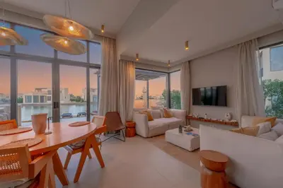 a living room with a table and a couch at Comfy 3BR Standalone in Tawila, El Gouna. Lagoon & Pool access in Hurghada