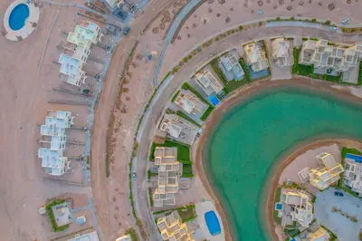 an aerial view of condos and houses on a beach at Comfy 3BR Standalone in Tawila, El Gouna. Lagoon & Pool access in Hurghada