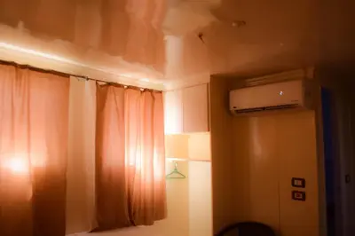 a room with a window with a curtain and a heater at Floating Hotel- Happy Nile Boat in Luxor