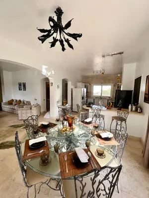 a dining room and kitchen with a table and chairs at GS 23 in Hurghada