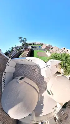 an aerial view of a building with a dome at Sunset Haven Guesthouse in Luxor