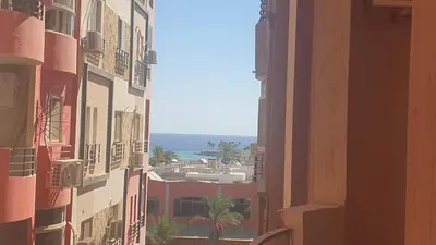 a view of a city from between two buildings at Sun, Sea & Comfort in Hurghada