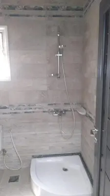 a bathroom with a shower with a toilet and a shower at Makramia studio in Hurghada
