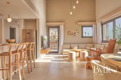 a kitchen and living room with a couch and a table at BYTK - Casa Del Mar in Hurghada