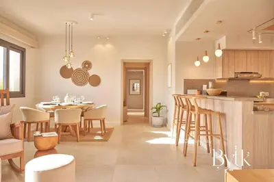 a kitchen and living room with a table and chairs at BYTK - Casa Del Mar in Hurghada