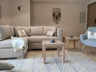 a living room with a couch and a table at Mangroovy Magic PoolView 1BR in Beachfront Complex M3 3A 13 in Hurghada