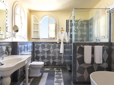 a bathroom with a sink toilet and a shower at La Maison Bleue El Gouna in Hurghada