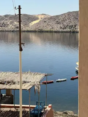a view of a body of water with boats in it at Ayujidda Nubian House in Aswan