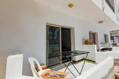 a small table on the balcony of a house at Makramia A107 studio in Hurghada