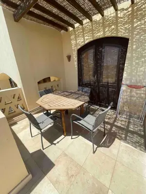 a patio with a table and chairs in a room at Spacious Villa with private pool-Gouna in Hurghada