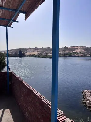 a view of a body of water with mountains in the background at Ajwa Guest House in Aswan