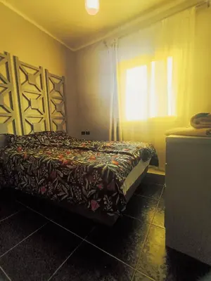 a bedroom with a bed and a window at Royal Beach Hurghada in Hurghada
