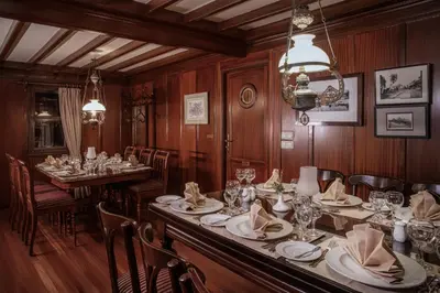 a dining room with a long table and chairs at Farouz El Nil I Nile Cruise - Every Monday from Luxor for 07 & 05 Nights in Ţawd
