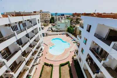 an aerial view of an apartment complex with a swimming pool at A216 flat Al Makramia in Hurghada