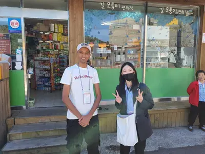 a man and a woman standing in front of a store at Reko Houses in Elephantine Island in Aswan