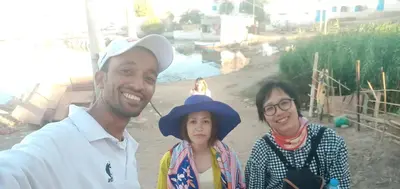 a man and two women posing for a picture at Reko Houses in Elephantine Island in Aswan