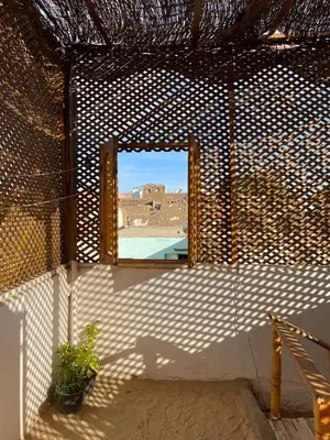 a window in a room with a view of a building at Reko Houses in Elephantine Island in Aswan