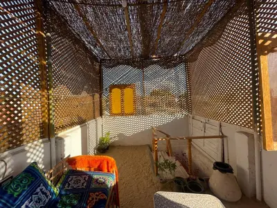 a room with a table and chairs in a room at Reko Houses in Elephantine Island in Aswan