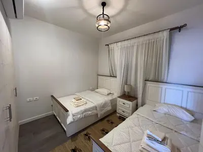 a bedroom with two beds and a window at Luxury 4 bedroom villa - Cyan ElGouna in Hurghada