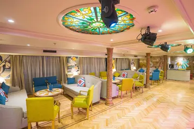 a room with couches and chairs and a stained glass ceiling at 4-Day 3-Night Guided Nile Cruise from Aswan to Luxor every Monday, Wednesday & Friday Departures in Aswan