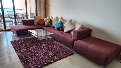 a living room with a couch and a coffee table at apartment 2 bedrooms in the view in Hurghada