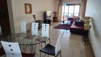 a living room with a glass table and chairs at apartment 2 bedrooms in the view in Hurghada
