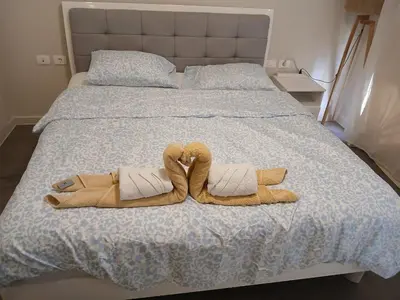 a bed with two towels on top of it at El Gouna, Cyan 2-Bedroom Ground Floor in El Gouna