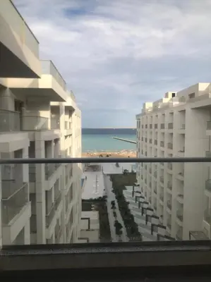 a view of the ocean from the balcony of a hotel at Scandic resort سكانديك ريزورت in Hurghada