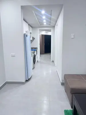 a hallway with a refrigerator in a room at Scandic resort سكانديك ريزورت in Hurghada