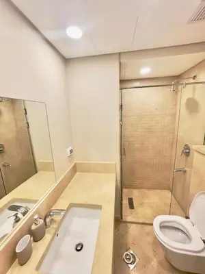 a bathroom with a shower and a sink and a toilet at Mangroovy M7-4A-03 in Hurghada