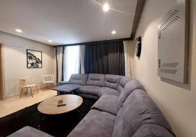a living room with a couch and a table at Warm 1BR with at Mangroovy, El-Gouna M1-7B in Hurghada