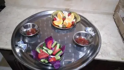 three small bowls of fruit on a silver tray at Ali habou {4} in Luxor